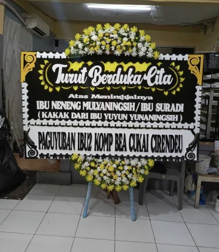 Papan Bunga Duka Axa Tower