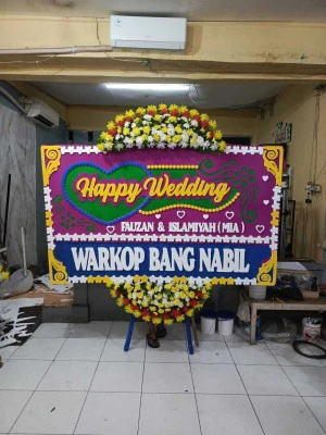 Papan Bunga di Axa Tower
