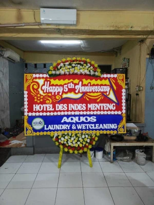 Papan Bunga di Axa Tower