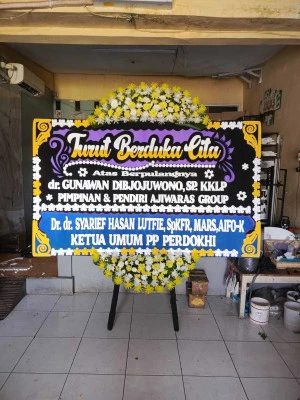 Papan Bunga di Axa Tower